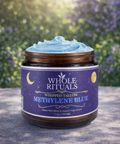 Jar of Whole Rituals Methylene Blue whipped tallow on a surface with a blurred natural background