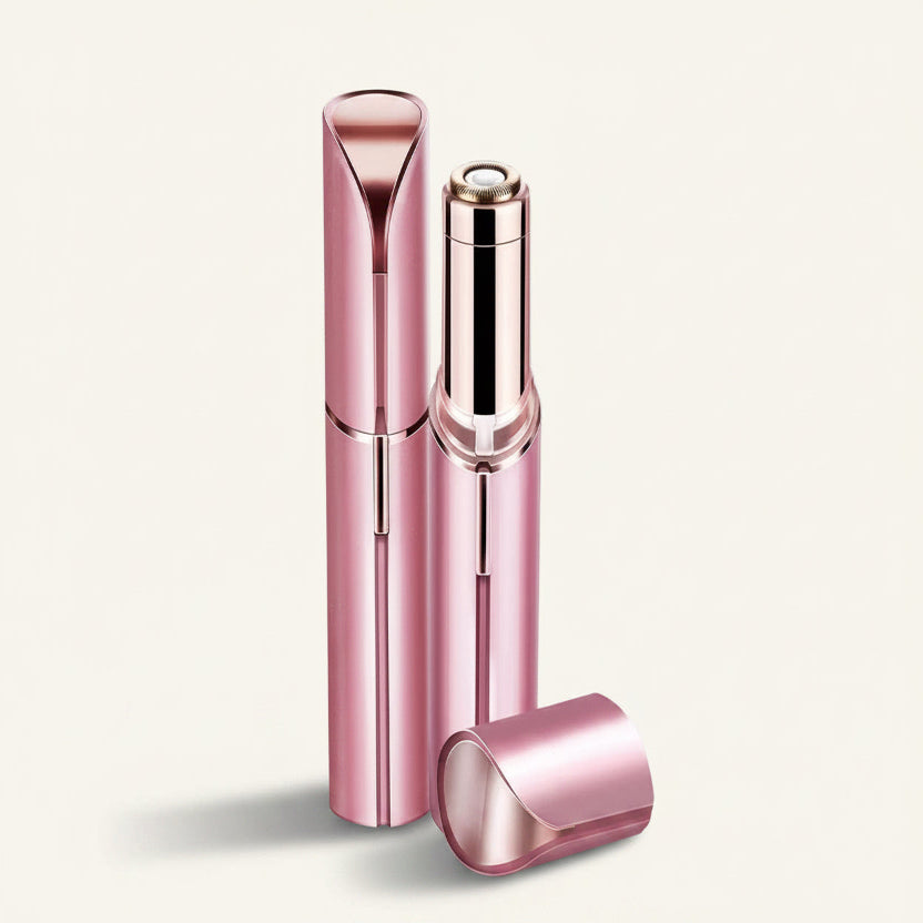 Three metallic pink cosmetic tubes on a warm off-white background, including one upright tube, one open tube showing the inner mechanism, and one cap lying in front.