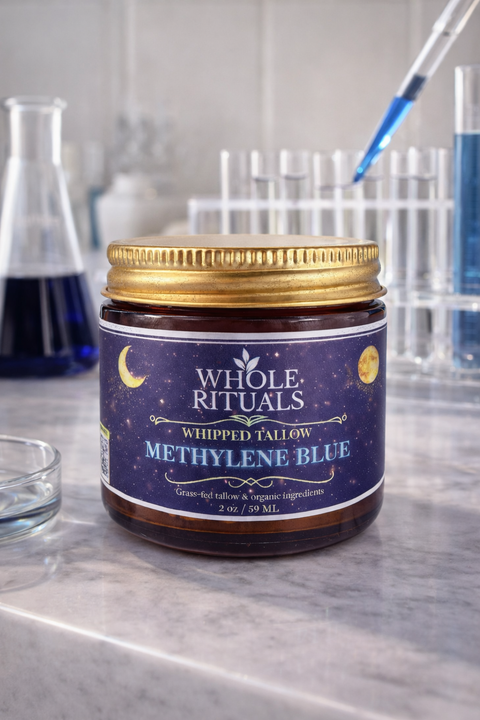 Jar of Whole Rituals Methylene Blue on a laboratory counter with test tubes in the background.