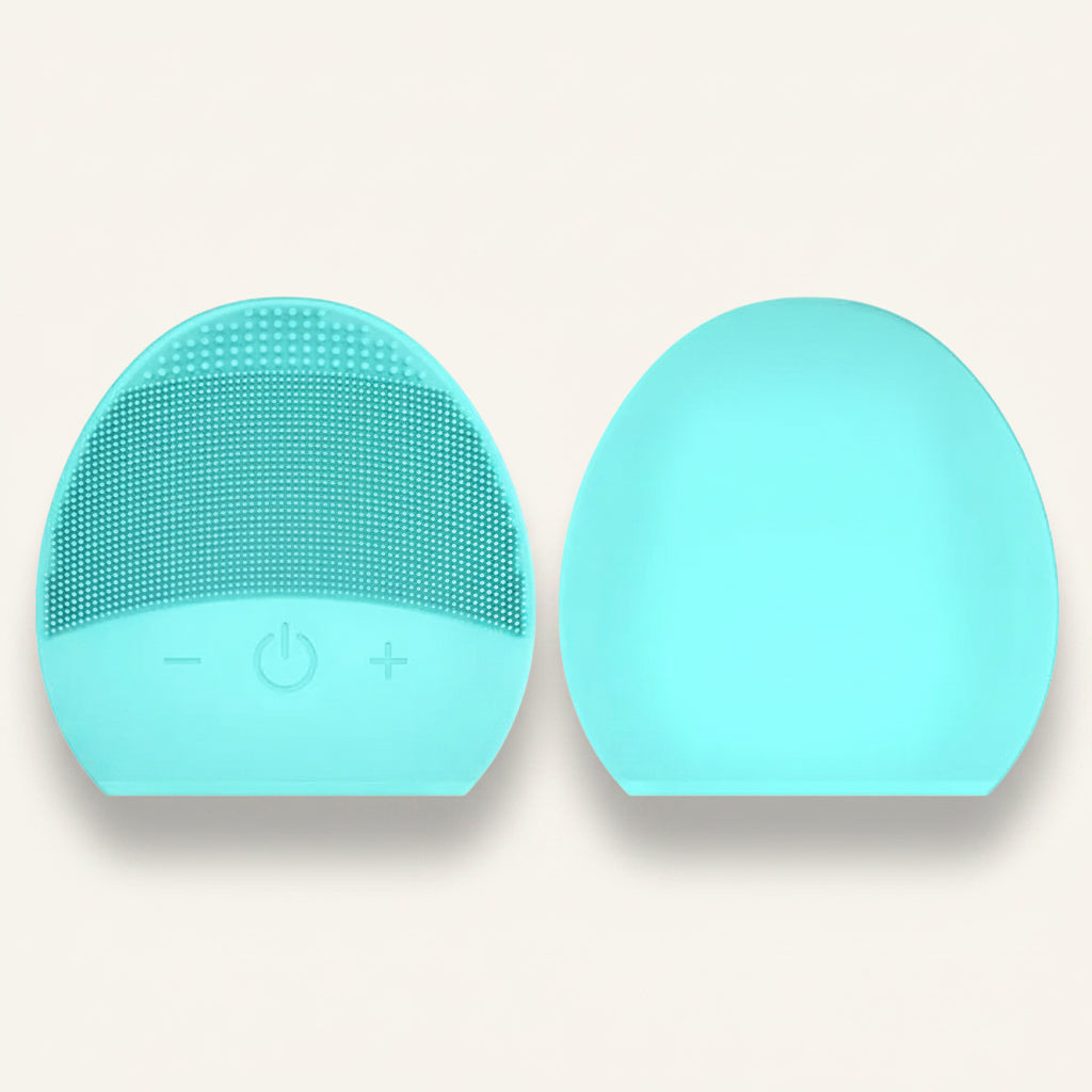 Two turquoise silicone face cleaning brushes on a white background