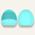 Two turquoise silicone face cleaning brushes on a white background