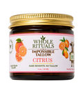 Jar of Whole Rituals Impossible Tallow Citrus product with a gold lid on a white background