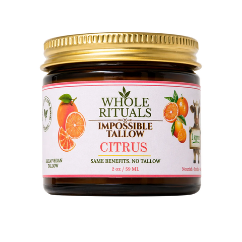 Jar of Whole Rituals Impossible Tallow Citrus product with a gold lid on a white background