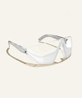 White safety goggles with silver frames on a white background