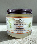 Jar of Whole Rituals Tallow Balm on a textured surface with a neutral background