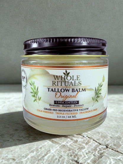 Jar of Whole Rituals Tallow Balm on a textured surface with a neutral background