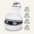 A white and gray electric scalp massage device with four interchangeable massage heads displayed on the right, set against a solid off-white background.