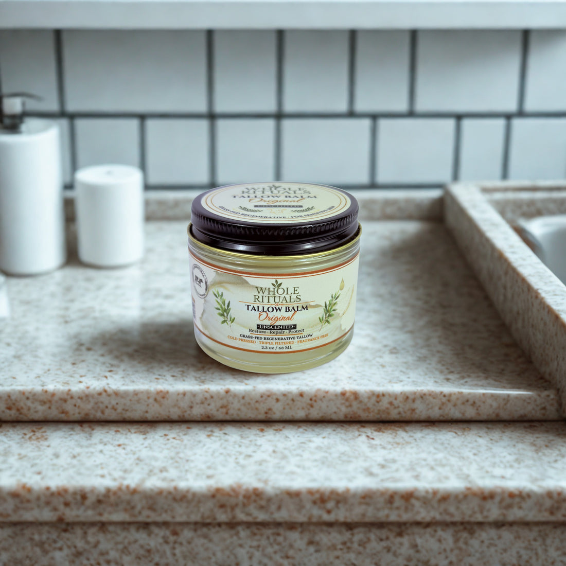 Jar of Whole Rituals Grass-Fed Beef Tallow Balm on a bathroom counter